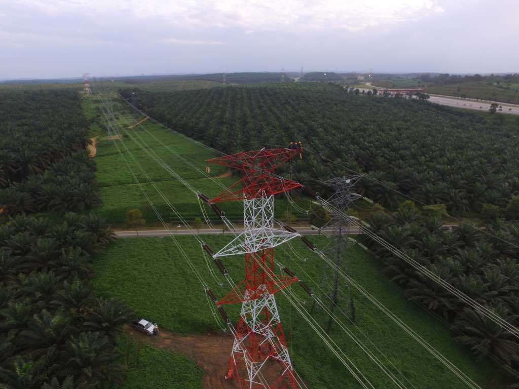 Installation crew working on transmission tower